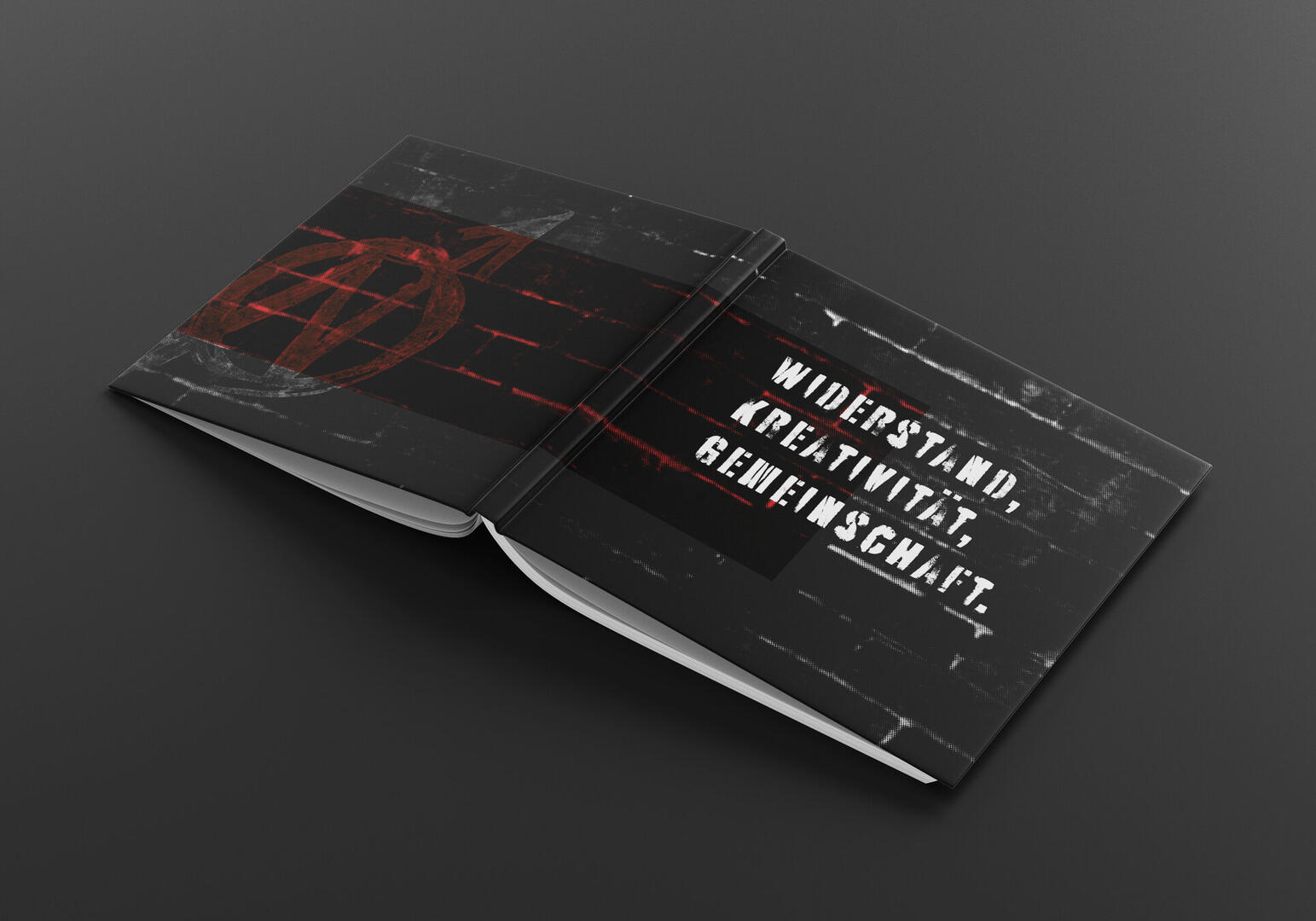 Book Layout Reference Open booklet with black pages, red abstract geometric design on left page, and white stencil-style text on right page reading 'WIDERSTAND, KREATIVITÄT, GEMEINSCHAFT.'